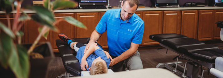 Chiropractor Mt Laurel Township NJ Devon Coughlin With Pediatric Patient